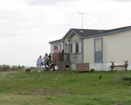 Women coming out of house